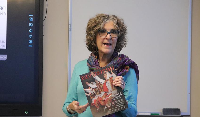 Debra showing one of her magazines .