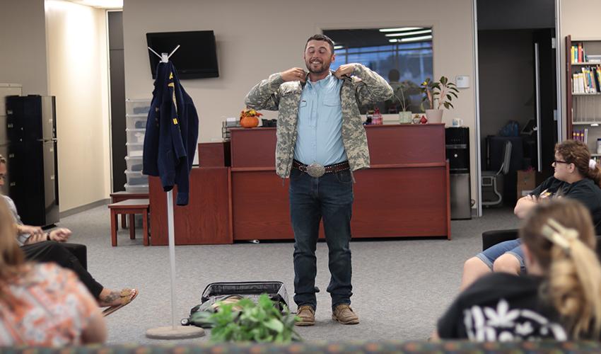 Tyler Froberg trying on a jacket.